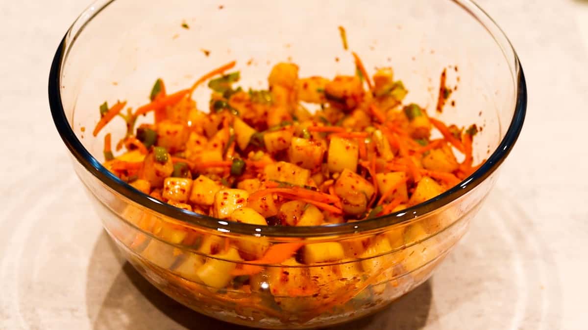 mix the vegetables and spices for Korean radish kimchi